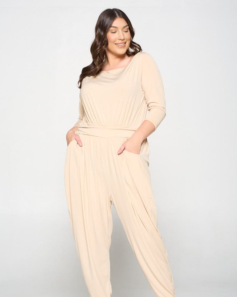Front of a model wearing a plus size Boat Neck Slingky Jumpsuit in Taupe by L I V D. | dia_product_style_image_id:240143